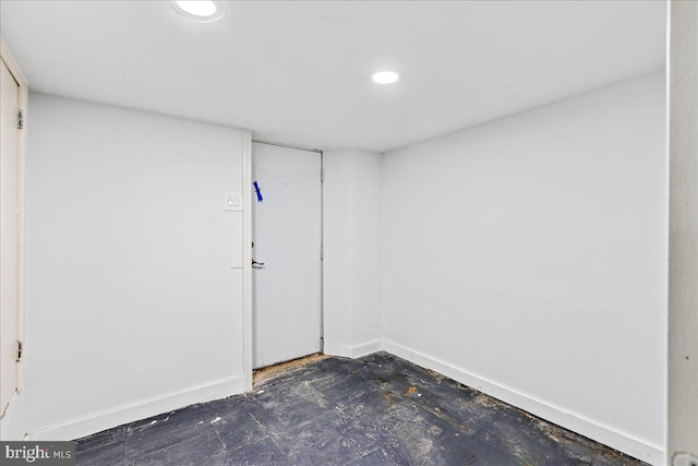 finished basement featuring baseboards and recessed lighting