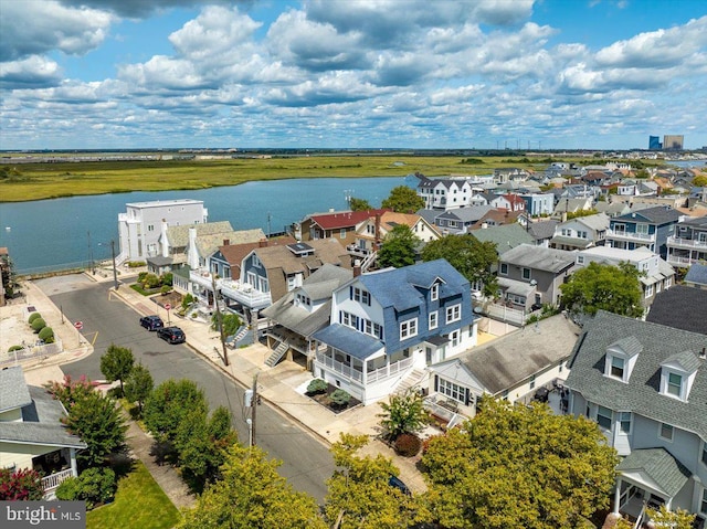 aerial view featuring a residential view and a water view