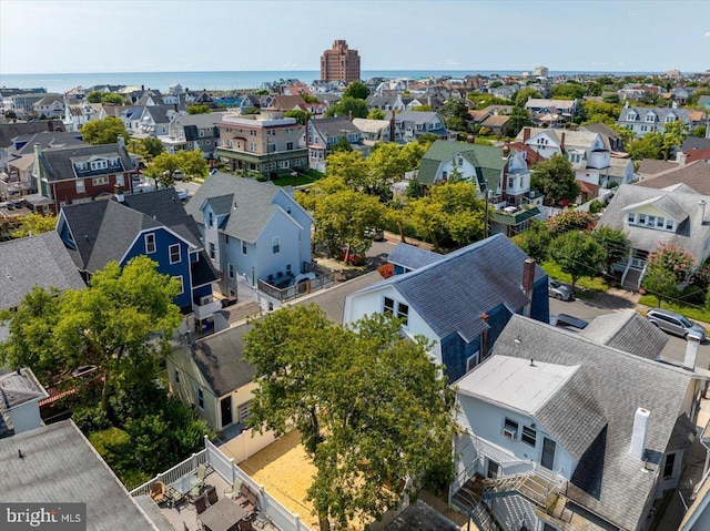 bird's eye view featuring a residential view and a water view