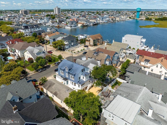 birds eye view of property featuring a water view and a residential view