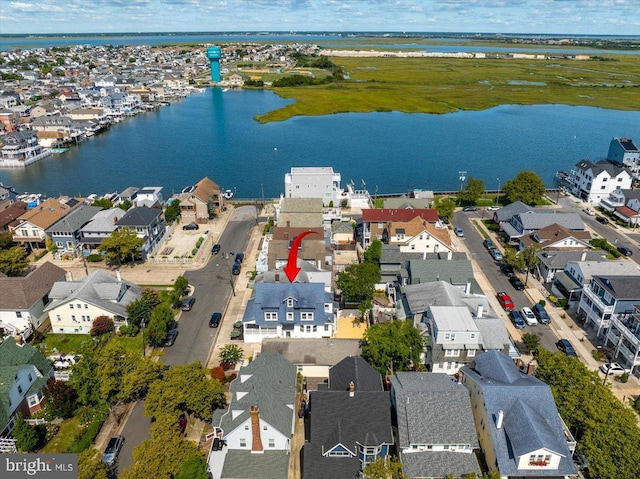 aerial view featuring a water view and a residential view