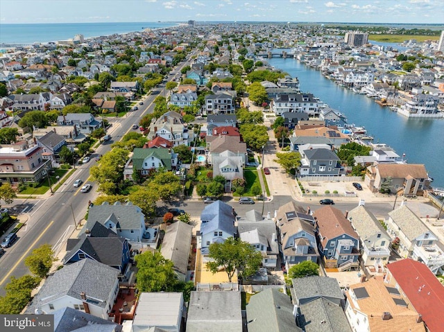 bird's eye view with a water view and a residential view