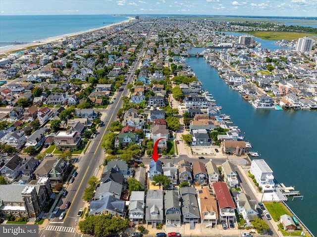 bird's eye view featuring a residential view and a water view