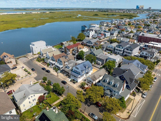 aerial view with a water view and a residential view