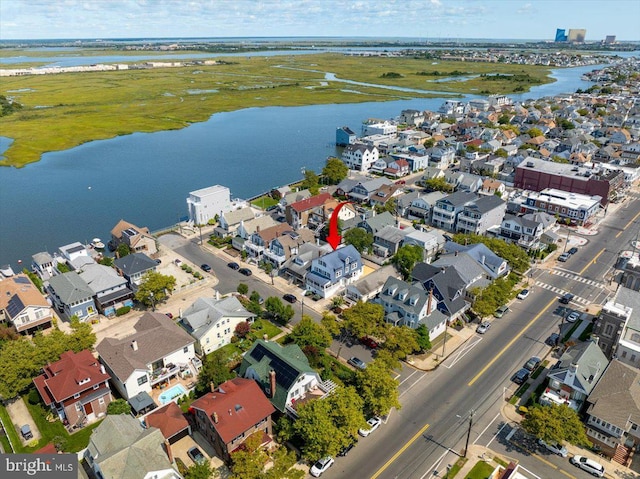 bird's eye view featuring a residential view and a water view