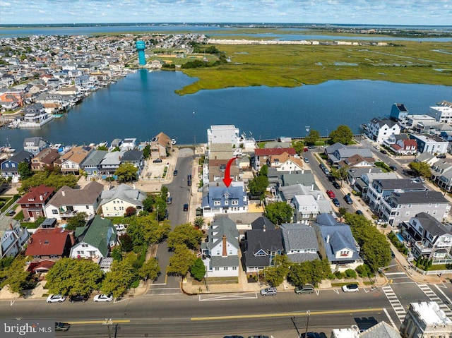 bird's eye view with a water view and a residential view