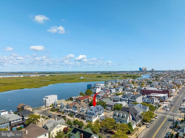 birds eye view of property featuring a residential view and a water view