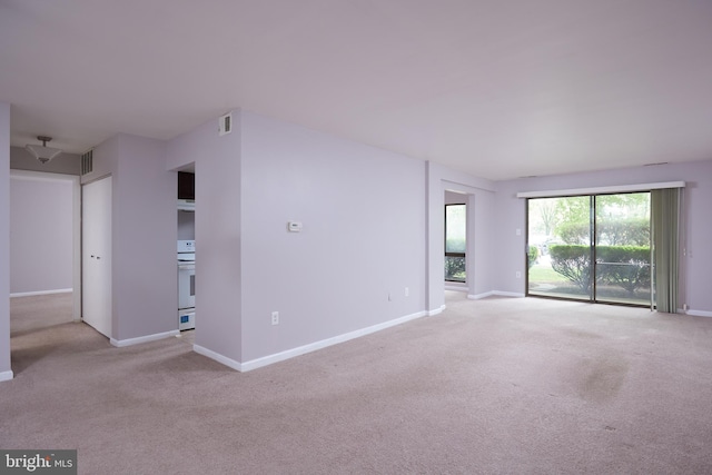 13213 Dairymaid Dr Unit 20, Germantown, MD 20874 - empty room featuring baseboards, visible vents, and light colored carpet