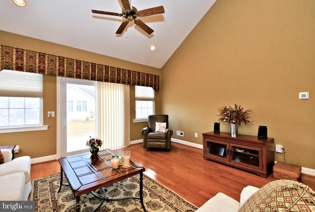 living area featuring ceiling fan, baseboards, wood finished floors, and recessed lighting