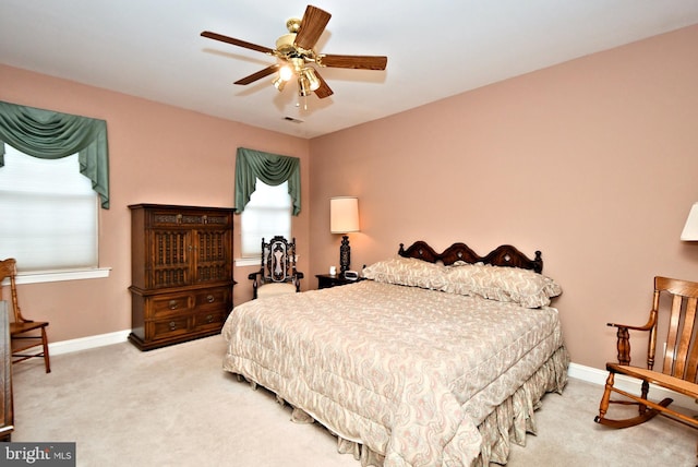 bedroom featuring a ceiling fan, baseboards, and carpet flooring