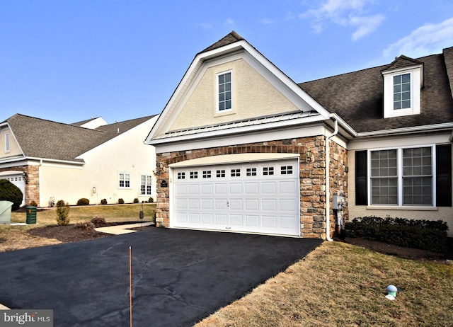 view of front of property featuring a garage, stone siding, aphalt driveway, roof with shingles, and stucco siding