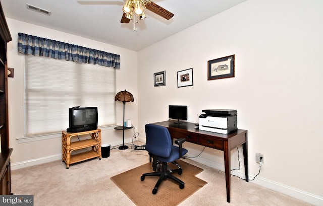 home office featuring a ceiling fan, baseboards, visible vents, and carpet flooring