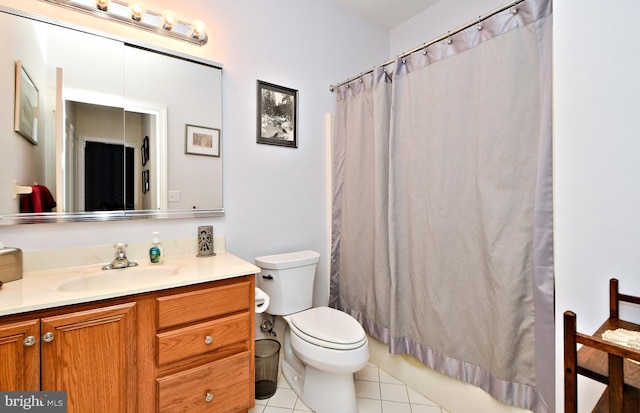 bathroom featuring vanity, toilet, and tile patterned floors