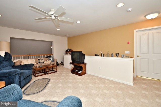 carpeted living area with baseboards, a ceiling fan, and recessed lighting