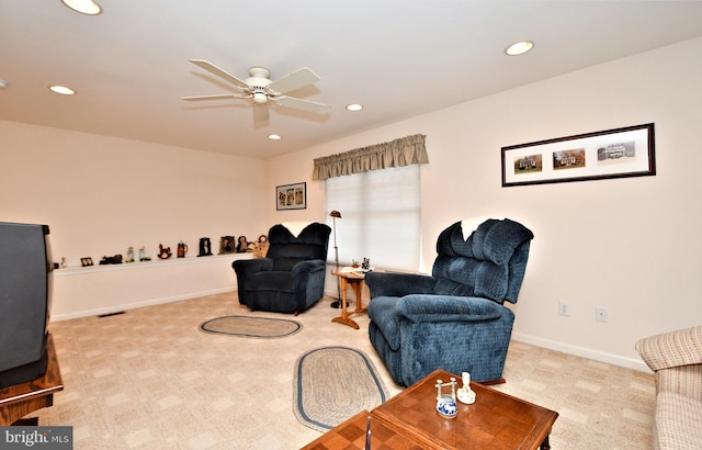 living area featuring carpet, baseboards, a ceiling fan, and recessed lighting