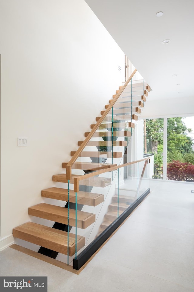 staircase featuring recessed lighting