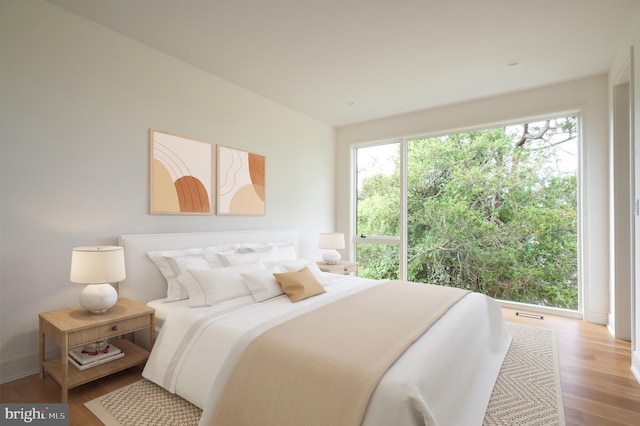 bedroom with wood finished floors