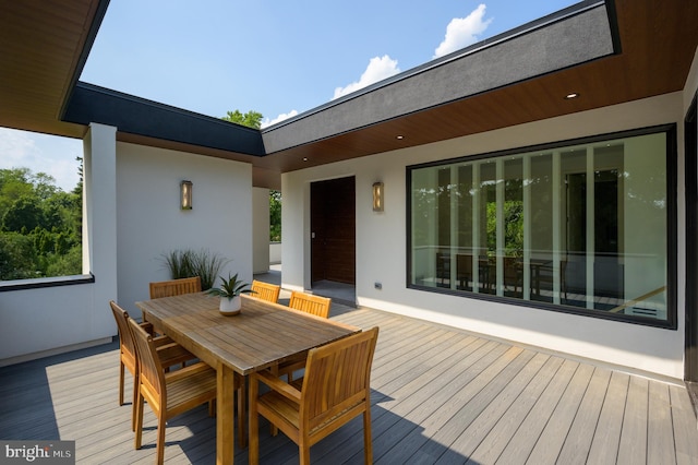 wooden deck with outdoor dining space