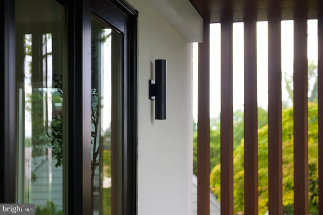 entrance to property featuring stucco siding