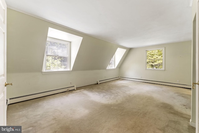 bonus room featuring a baseboard radiator, vaulted ceiling, and carpet flooring