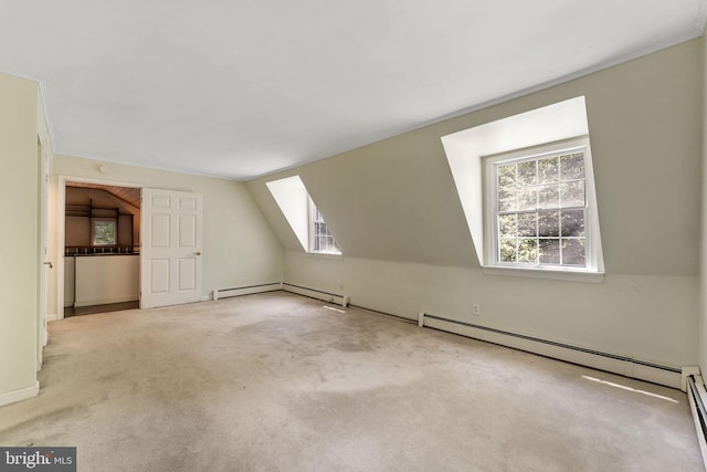 bonus room featuring carpet, a baseboard radiator, and vaulted ceiling