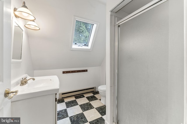 bathroom featuring toilet, tile patterned floors, vanity, a shower stall, and a baseboard heating unit