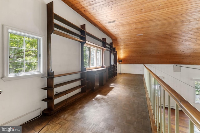 hall featuring vaulted ceiling, wooden ceiling, visible vents, and a healthy amount of sunlight