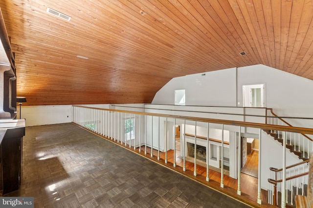 bonus room with vaulted ceiling, wood ceiling, and visible vents