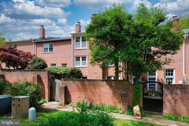 view of property featuring a fenced front yard