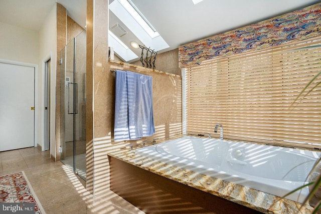 full bathroom featuring a garden tub, a shower stall, visible vents, and tile patterned floors