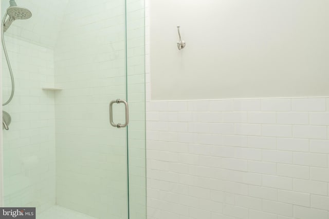 full bath featuring a shower stall