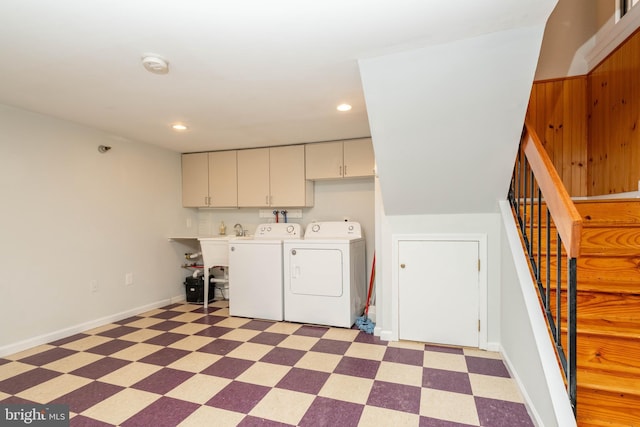 laundry area featuring recessed lighting, baseboards, cabinet space, light floors, and washing machine and clothes dryer