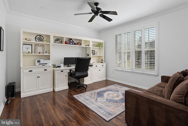 office area featuring a ceiling fan, crown molding, baseboards, and dark wood-style flooring