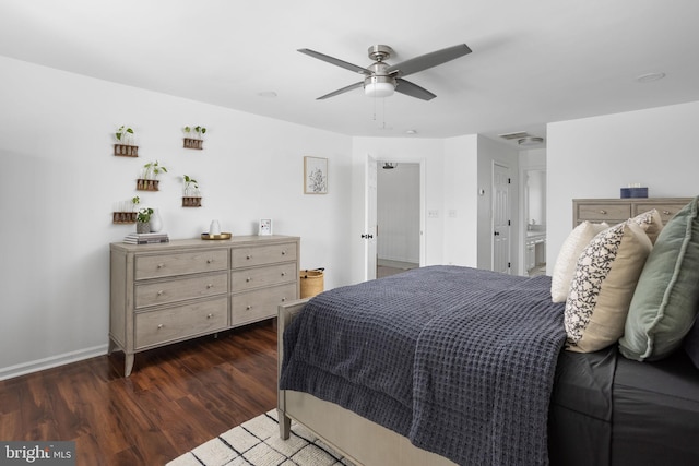 bedroom featuring dark wood finished floors, a ceiling fan, and baseboards