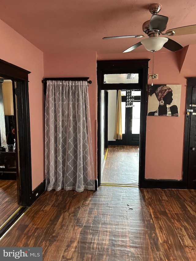 interior space with ceiling fan and wood finished floors