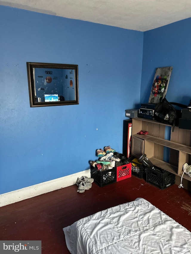 bedroom with wood finished floors