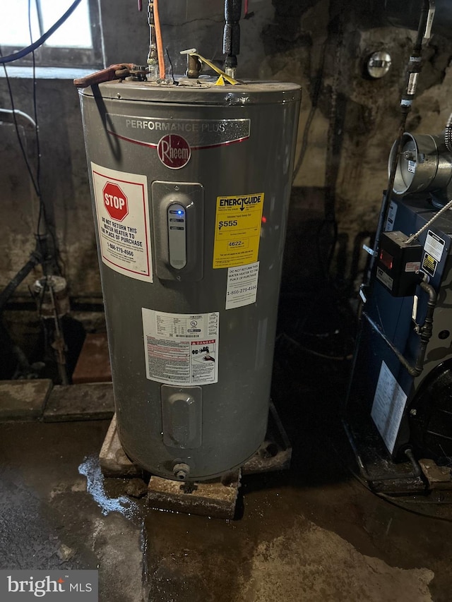 utility room featuring water heater