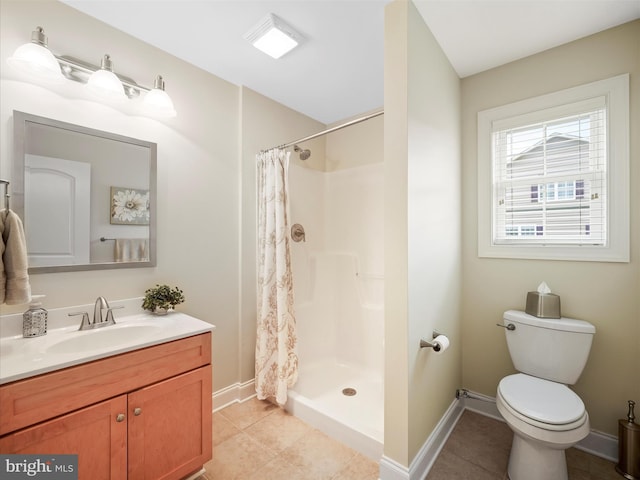 bathroom with a shower with curtain, tile patterned flooring, vanity, and toilet