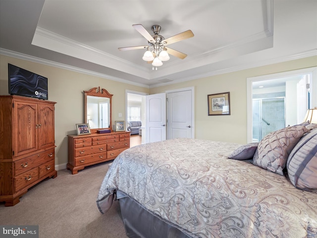 bedroom featuring ornamental molding, a raised ceiling, light carpet, and ceiling fan