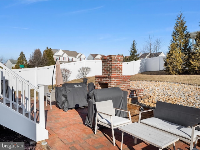 view of patio featuring area for grilling and a fenced backyard