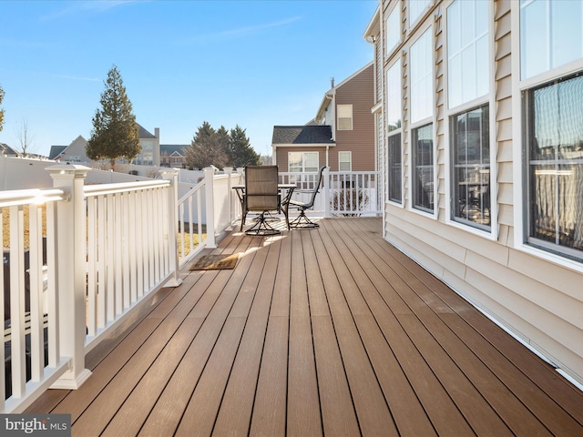 wooden deck featuring outdoor dining space