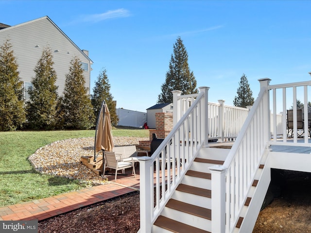 exterior space featuring a yard and stairway