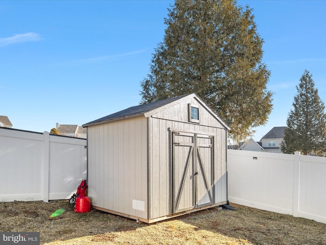 view of shed featuring a fenced backyard