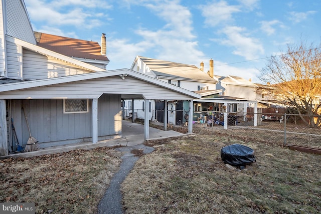 rear view of house with fence