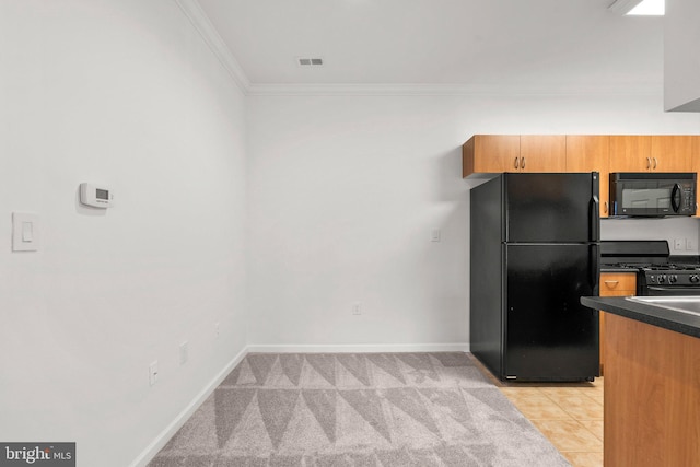 kitchen featuring light tile patterned floors, dark countertops, ornamental molding, black appliances, and baseboards