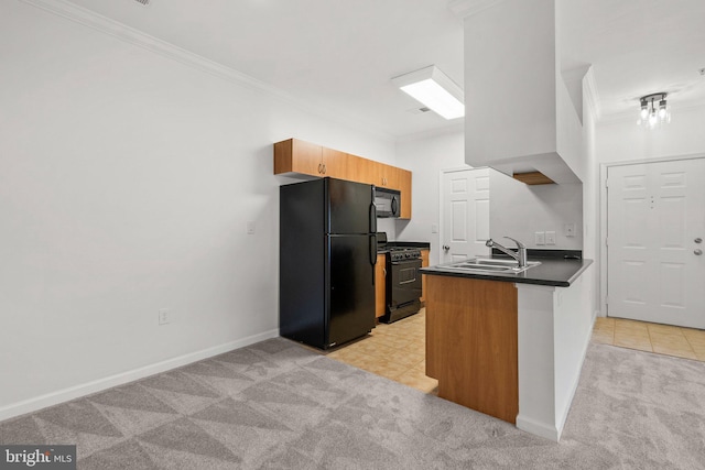 kitchen with light colored carpet, a sink, black appliances, dark countertops, and crown molding