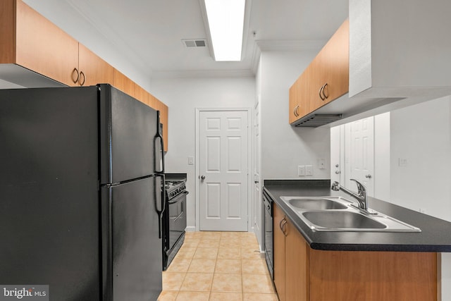 kitchen with dark countertops, visible vents, a sink, and black appliances