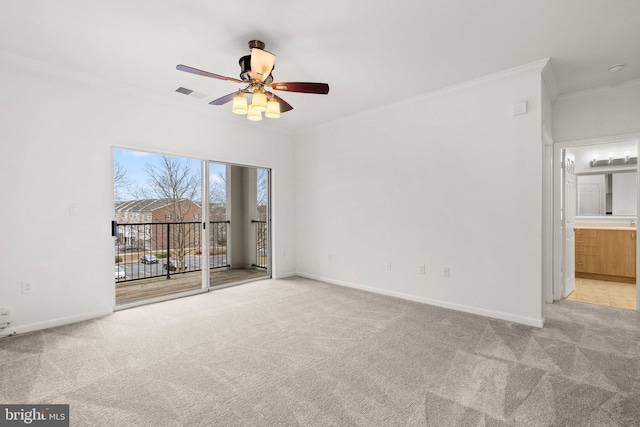 unfurnished room featuring light carpet, crown molding, visible vents, and baseboards