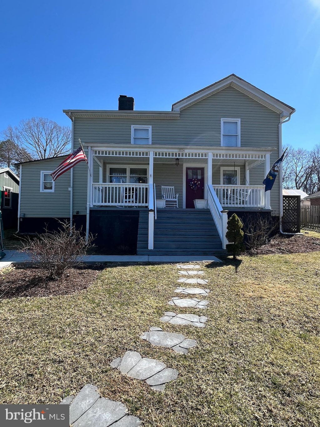 view of front of house with stairs and a porch