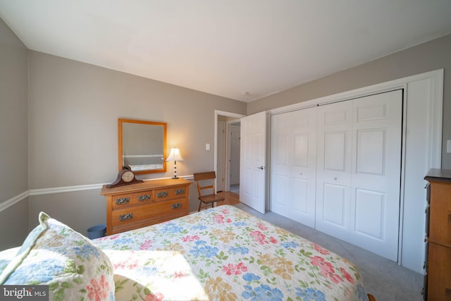 carpeted bedroom featuring a closet